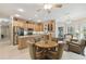 Open kitchen with an island, stainless steel appliances, and breakfast nook at 554 Heartwell Dr, Kissimmee, FL 34759