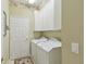 Laundry room with washer, dryer, and cabinets at 554 Heartwell Dr, Kissimmee, FL 34759