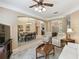 Relaxing living room featuring comfortable seating and a large TV at 554 Heartwell Dr, Kissimmee, FL 34759
