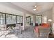 Relaxing sunroom featuring comfortable seating and plenty of natural light at 554 Heartwell Dr, Kissimmee, FL 34759