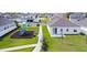 Community view with playground and homes at 566 Pawnee Ct, Haines City, FL 33844