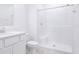Clean bathroom with a shower and white tile at 566 Pawnee Ct, Haines City, FL 33844