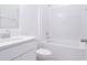 Clean bathroom with white vanity, bathtub, and tile at 566 Pawnee Ct, Haines City, FL 33844