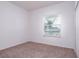 Bright bedroom with neutral carpet and window at 566 Pawnee Ct, Haines City, FL 33844