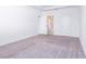 Spacious bedroom with carpet and access to a bathroom at 566 Pawnee Ct, Haines City, FL 33844