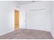 Bedroom with carpet, double doors and access to another room at 566 Pawnee Ct, Haines City, FL 33844