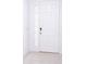 White front door with glass panels and keyless entry at 566 Pawnee Ct, Haines City, FL 33844