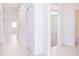 Hallway with tile floors, linen closet, and bedroom access at 566 Pawnee Ct, Haines City, FL 33844