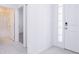 Bright hallway with tile floors and doors to bathroom and bedroom at 566 Pawnee Ct, Haines City, FL 33844