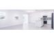 Eat-in kitchen with island, white cabinets and sliding door access to backyard at 566 Pawnee Ct, Haines City, FL 33844