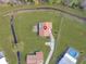 Aerial view showing home's location, landscaping, and neighborhood at 713 Green Ct, Kissimmee, FL 34759