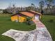 Single story home, spacious backyard, and a long driveway at 713 Green Ct, Kissimmee, FL 34759