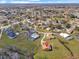 Wide aerial showcasing the home's location in a residential neighborhood at 713 Green Ct, Kissimmee, FL 34759