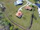 Aerial view showing a home's location in a residential neighborhood with green space at 713 Green Ct, Kissimmee, FL 34759