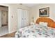 Bedroom with double doors and floral bedspread at 713 Green Ct, Kissimmee, FL 34759