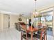 Spacious dining area with a wooden table and chandelier at 713 Green Ct, Kissimmee, FL 34759