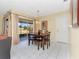 Dining area with a wooden table and chairs, near the living room at 713 Green Ct, Kissimmee, FL 34759