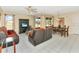 Bright living room with tiled floors, comfortable seating, and a dining area at 713 Green Ct, Kissimmee, FL 34759