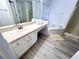 Clean bathroom with a vanity, bathtub, and shower at 8417 Secret Key Cove, Kissimmee, FL 34747