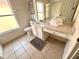 Bathroom with vanity, toilet and shower at 8417 Secret Key Cove, Kissimmee, FL 34747