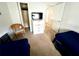 Bedroom with two twin beds, dresser, and wicker chair at 8417 Secret Key Cove, Kissimmee, FL 34747