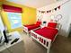 Mickey Mouse themed bedroom with two twin beds at 8417 Secret Key Cove, Kissimmee, FL 34747