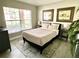 Bedroom with a queen bed and large window at 8417 Secret Key Cove, Kissimmee, FL 34747