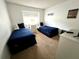 Two twin beds, dresser, and window in bright bedroom at 8417 Secret Key Cove, Kissimmee, FL 34747
