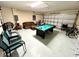 Basement game room with pool table and garage access at 8417 Secret Key Cove, Kissimmee, FL 34747