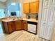 Functional kitchen with oak cabinets and a built in dishwasher at 8417 Secret Key Cove, Kissimmee, FL 34747