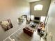 Open concept living room with high ceilings, hardwood floors, and plenty of natural light at 8417 Secret Key Cove, Kissimmee, FL 34747
