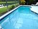 Relaxing screened-in pool with lake view at 8417 Secret Key Cove, Kissimmee, FL 34747
