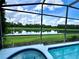 Relaxing pool and spa area with a stunning lake view at 8417 Secret Key Cove, Kissimmee, FL 34747