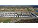 Aerial view of the community highlighting the neighborhood, landscaping, and golf course at 853 Ocean Course Ave # 853, Davenport, FL 33896