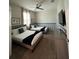 Inviting bedroom featuring two beds, ceiling fan, and a wall-mounted television at 853 Ocean Course Ave # 853, Davenport, FL 33896