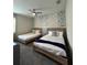 Nicely decorated bedroom featuring two beds and decorative wall at 853 Ocean Course Ave # 853, Davenport, FL 33896