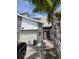 Charming townhouse with a one car garage, stone accents and a bright red front door at 853 Ocean Course Ave # 853, Davenport, FL 33896