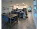 Bright kitchen with a breakfast bar island and stainless steel appliances at 853 Ocean Course Ave # 853, Davenport, FL 33896