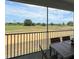 Screened patio with outdoor seating and a view of the lush green golf course at 853 Ocean Course Ave # 853, Davenport, FL 33896