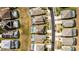 Aerial view of a house and surrounding neighborhood with pools at 8614 La Isla Dr, Kissimmee, FL 34747