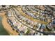 Aerial view showcasing neighborhood by a lake with pools at 8614 La Isla Dr, Kissimmee, FL 34747