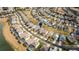 Aerial view of home and neighborhood with pools and lake at 8614 La Isla Dr, Kissimmee, FL 34747