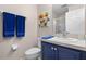 Clean bathroom with blue vanity and shower at 8614 La Isla Dr, Kissimmee, FL 34747