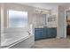 Primary bathroom with soaking tub and double vanity at 8614 La Isla Dr, Kissimmee, FL 34747