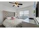 Bright bedroom with a large bed and window at 8614 La Isla Dr, Kissimmee, FL 34747