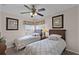Cozy bedroom with twin beds, ceiling fan, and ample natural light at 8614 La Isla Dr, Kissimmee, FL 34747