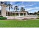 Grand entrance to Emerald Island with a fountain and landscaping at 8614 La Isla Dr, Kissimmee, FL 34747