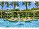 Emerald Island entrance, featuring a beautiful fountain and palm trees at 8614 La Isla Dr, Kissimmee, FL 34747