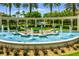 Elegant entrance to Emerald Island with a large fountain featuring dolphin sculptures at 8614 La Isla Dr, Kissimmee, FL 34747