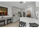 Spacious kitchen with gray cabinets, quartz countertops, and stainless steel appliances at 8614 La Isla Dr, Kissimmee, FL 34747